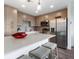 Modern kitchen with stainless steel appliances and an island at 1709 N Tamiami Trl # A421, Sarasota, FL 34234