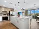 Open concept kitchen features island and stainless steel appliances at 1709 N Tamiami Trl # A421, Sarasota, FL 34234