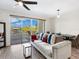 Living room with comfy sofa and access to balcony at 1709 N Tamiami Trl # A421, Sarasota, FL 34234