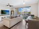 Bright living room, hardwood floors, and access to balcony at 1709 N Tamiami Trl # A421, Sarasota, FL 34234