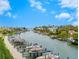 Calm waterway with many boats docked at private slips at 1709 N Tamiami Trl # A421, Sarasota, FL 34234