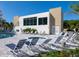 Relaxing pool area with lounge chairs and spa at 1709 N Tamiami Trl # A421, Sarasota, FL 34234