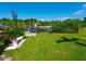 Landscaped green space with bench overlooking waterfront at 1709 N Tamiami Trl # A421, Sarasota, FL 34234
