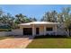 Newly constructed craftsman style home with a metal roof, paver driveway and fenced yard at 1712 6Th E Ave, Bradenton, FL 34208