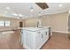 Modern kitchen with white cabinets, quartz countertops, and stainless steel appliances at 1712 6Th E Ave, Bradenton, FL 34208