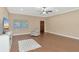 Bright living room with hardwood floors, a comfy recliner, and a large TV at 1712 6Th E Ave, Bradenton, FL 34208