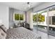 Serene bedroom with sliding glass doors opening to the pool area at 2004 S Osprey Ave, Sarasota, FL 34239