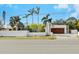 Modern home with white walls, wood garage door, and palm trees at 2004 S Osprey Ave, Sarasota, FL 34239