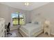 Bright bedroom with a comfortable bed and a view at 20717 Benissimo Dr, Venice, FL 34293