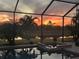 Stunning sunset view from the screened pool area at 20717 Benissimo Dr, Venice, FL 34293