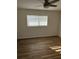 Bedroom with wood-look floors and ceiling fan at 2715 Nancy St, Sarasota, FL 34237