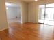 Versatile bonus room with wood flooring and access to a patio at 302 Spring Lakes Blvd # 302, Bradenton, FL 34210