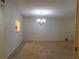 Dining room illuminated by a stylish chandelier and freshly painted walls at 302 Spring Lakes Blvd # 302, Bradenton, FL 34210