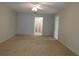 Large main bedroom with carpeted floors and ensuite bathroom at 302 Spring Lakes Blvd # 302, Bradenton, FL 34210