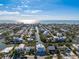 Stunning aerial view of a waterfront home with canal access and breathtaking ocean views in a desirable community at 329 Tarpon St, Anna Maria, FL 34216