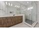Modern bathroom with a frameless glass shower and double vanity at 329 Tarpon St, Anna Maria, FL 34216