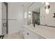Modern bathroom with white vanity, quartz countertop and frameless shower at 329 Tarpon St, Anna Maria, FL 34216