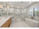 Luxurious bathroom with a soaking tub, large shower, and marble finishes at 329 Tarpon St, Anna Maria, FL 34216