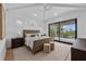 Bright bedroom with high ceilings, sliding glass doors, and water views at 329 Tarpon St, Anna Maria, FL 34216