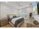 Second bedroom with light and airy feel, featuring access to a private balcony at 329 Tarpon St, Anna Maria, FL 34216