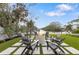 Fire pit area with artificial turf and waterfront views at 329 Tarpon St, Anna Maria, FL 34216