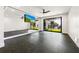 Home gym with mirrored walls and sliding glass doors at 329 Tarpon St, Anna Maria, FL 34216