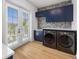 Bright laundry room, featuring modern appliances and custom cabinetry at 329 Tarpon St, Anna Maria, FL 34216