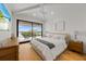 Spacious main bedroom with water views and private balcony at 329 Tarpon St, Anna Maria, FL 34216