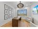 Home office featuring a large window, wood desk and comfortable seating at 329 Tarpon St, Anna Maria, FL 34216