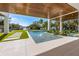 Covered patio with a view of the pool and canal at 329 Tarpon St, Anna Maria, FL 34216