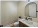 Modern powder room with patterned wallpaper and a quartz countertop at 329 Tarpon St, Anna Maria, FL 34216