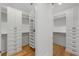 Spacious walk-in closet with ample shelving and drawer space at 329 Tarpon St, Anna Maria, FL 34216