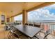 Spacious balcony with outdoor dining area and stunning water views at 35 Watergate Dr # 1203, Sarasota, FL 34236