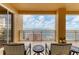 Spacious balcony with water views and comfortable seating for two at 35 Watergate Dr # 1203, Sarasota, FL 34236