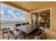 Balcony with a dining table, seating for six, and stunning water views at 35 Watergate Dr # 1203, Sarasota, FL 34236