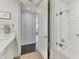 Bathroom with white subway tile and glass shower enclosure at 35 Watergate Dr # 1203, Sarasota, FL 34236