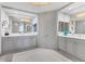 Elegant bathroom with double vanity and mosaic tile floor at 35 Watergate Dr # 1203, Sarasota, FL 34236