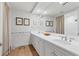 Bathroom with double vanity and neutral color scheme at 35 Watergate Dr # 1203, Sarasota, FL 34236