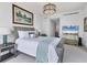 Bedroom with built-in TV and coastal-themed decor at 35 Watergate Dr # 1203, Sarasota, FL 34236