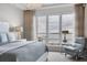 Bright bedroom with large windows and water view at 35 Watergate Dr # 1203, Sarasota, FL 34236
