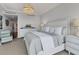 Spacious bedroom with light color palette and water view at 35 Watergate Dr # 1203, Sarasota, FL 34236