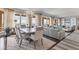 Spacious dining area with a large table and bay windows at 35 Watergate Dr # 1203, Sarasota, FL 34236