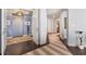 Modern entryway with hardwood floors and unique rug at 35 Watergate Dr # 1203, Sarasota, FL 34236