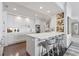 Contemporary kitchen featuring white cabinets and a large island at 35 Watergate Dr # 1203, Sarasota, FL 34236