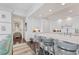 Modern kitchen with white cabinets and marble countertops at 35 Watergate Dr # 1203, Sarasota, FL 34236