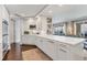 Stylish kitchen with white cabinetry and marble countertops at 35 Watergate Dr # 1203, Sarasota, FL 34236