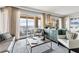 Spacious living room with water views and stylish decor at 35 Watergate Dr # 1203, Sarasota, FL 34236