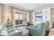 Relaxing living room with ocean views and built-in entertainment center at 35 Watergate Dr # 1203, Sarasota, FL 34236