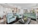 Open living area with kitchen and comfortable seating at 35 Watergate Dr # 1203, Sarasota, FL 34236