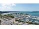 Aerial perspective of a marina, showcasing numerous boats and surrounding cityscape at 35 Watergate Dr # 1203, Sarasota, FL 34236